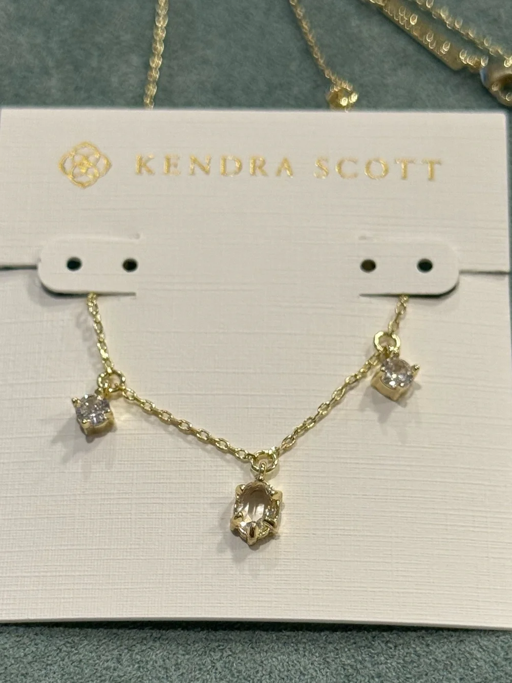 Kendra Scott | 7-Stone Caitlin Gold Plated Necklace | Clear Stone Charms - Picture 3 of 4